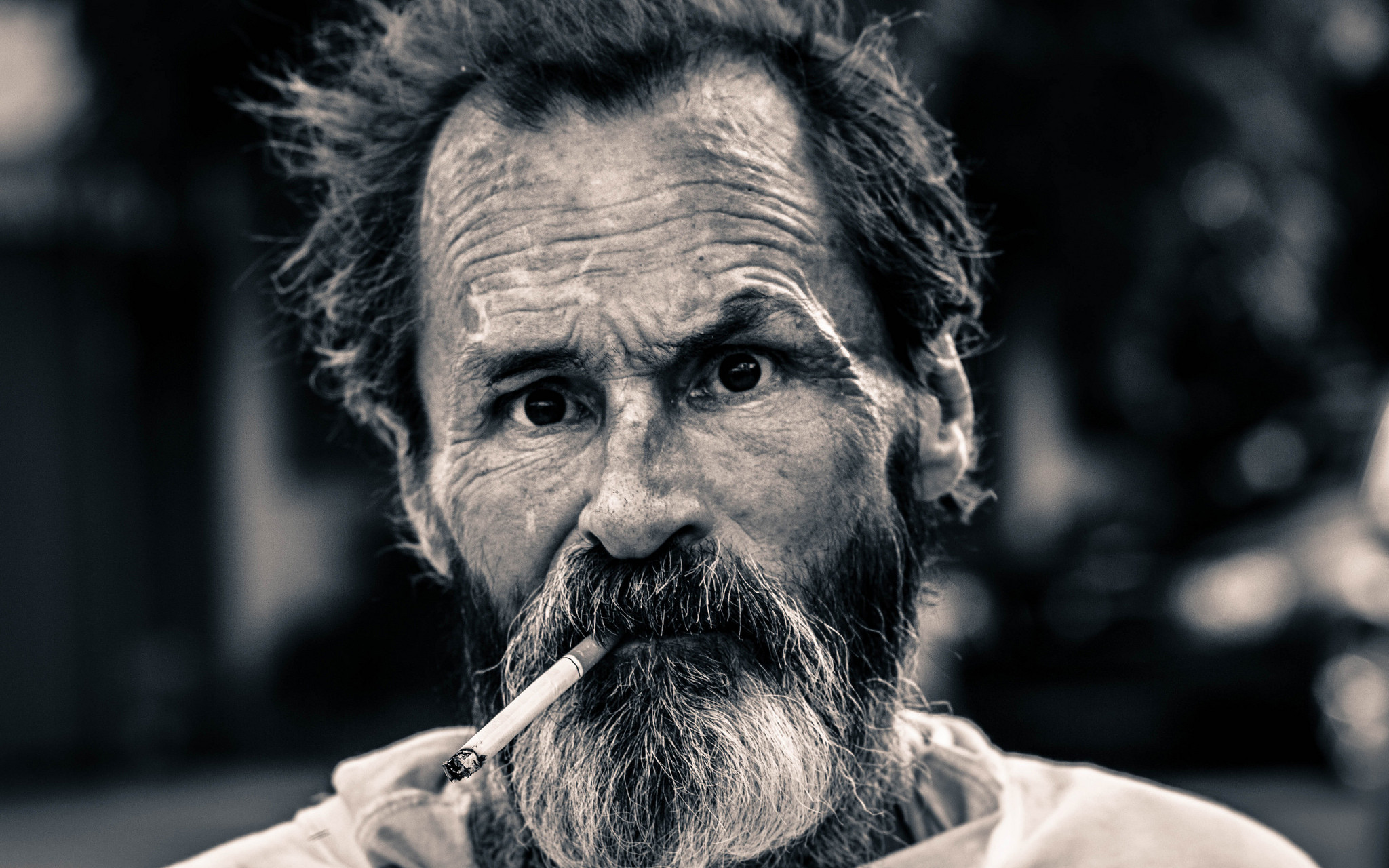 Image: Picture of a homeless man with cigarette in his mouth.