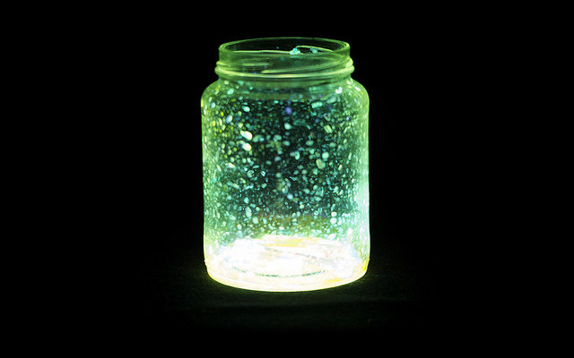 Image: A strange jar with stains and green lighting.