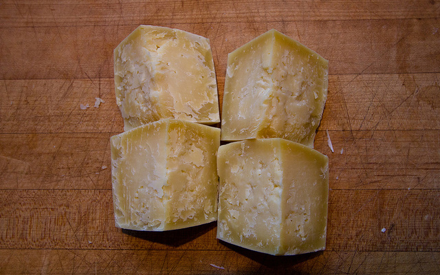 Image: Four blocks of Parmesan cheese.