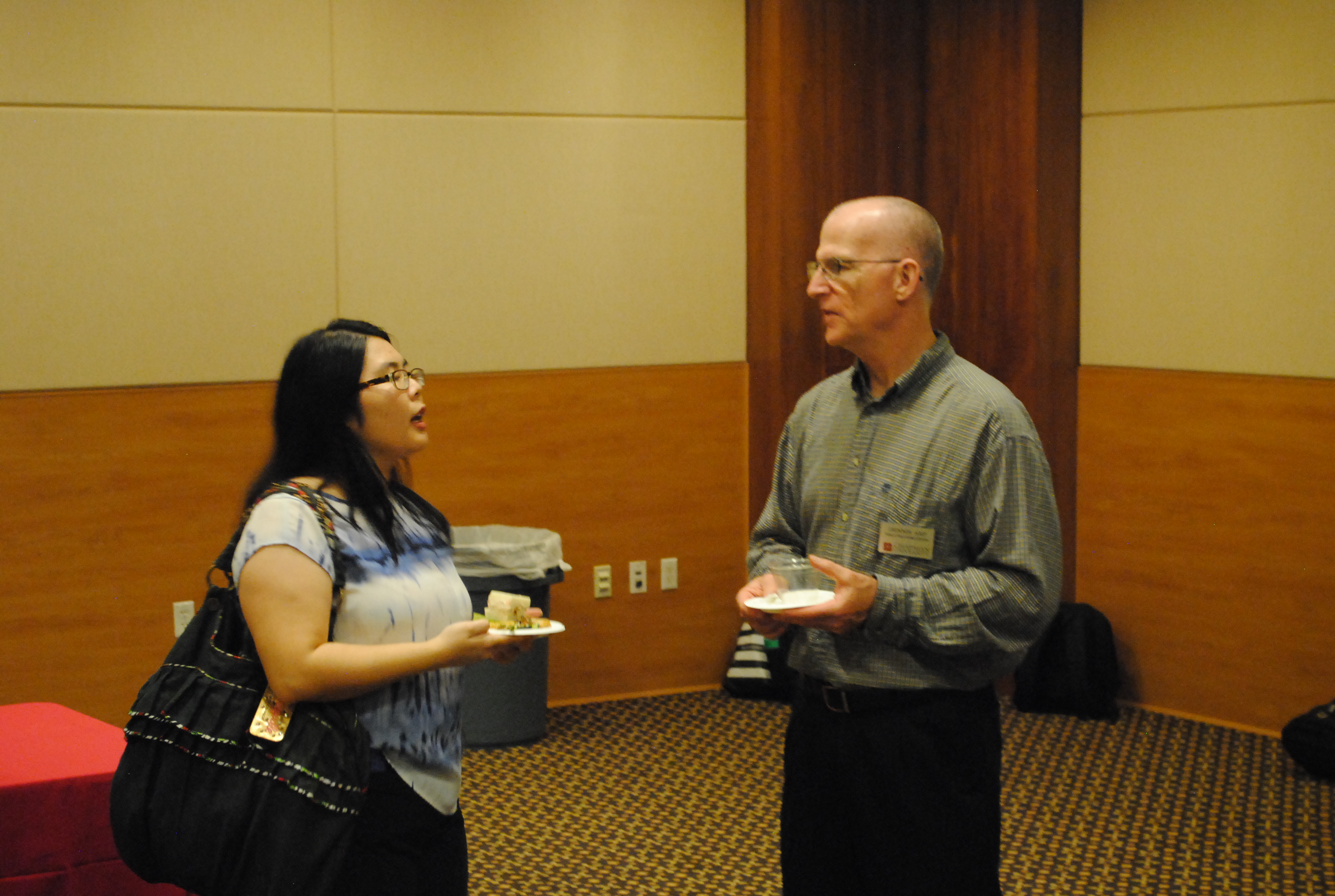 Image: Ian Barnard, right, and Lisa Ko, left, talking.