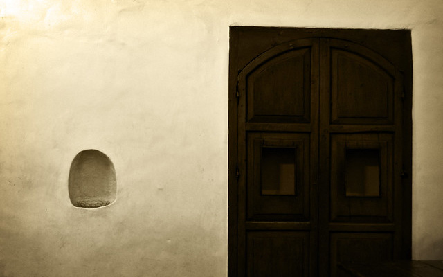 Image: Wooden confessional door.